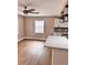 Eat-in kitchen features modern lighting, sleek countertops and wood look floors at 3620 E Tampa Cir, Tampa, FL 33629