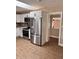 Bright kitchen with stainless steel appliances, white cabinets, and eat-in area at 3620 E Tampa Cir, Tampa, FL 33629