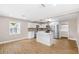 Modern kitchen with island, stainless steel appliances and stylish pendant lights, creating a chef's haven at 3620 E Tampa Cir, Tampa, FL 33629