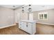 An open kitchen with an island boasting drawers and cabinets, complemented by recessed lighting at 3620 E Tampa Cir, Tampa, FL 33629