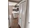 Hallway view of a modern kitchen with an island and stainless steel appliances at 3620 E Tampa Cir, Tampa, FL 33629