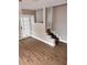 A spacious living room featuring modern floors, stairs and access to exterior entry at 3620 E Tampa Cir, Tampa, FL 33629