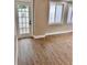 Living room featuring new floors, a glass door, and bright natural light at 3620 E Tampa Cir, Tampa, FL 33629