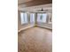 A bright living room featuring new floors and ample natural light through multiple windows at 3620 E Tampa Cir, Tampa, FL 33629