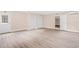 A well-lit interior space with modern flooring and convenient access to closets and exterior door at 3620 E Tampa Cir, Tampa, FL 33629