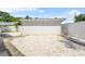 Exterior parking area with fresh gravel, providing a clean and functional space for vehicles at 3620 E Tampa Cir, Tampa, FL 33629