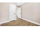 Empty room with luxury vinyl plank flooring and neutral paint, ready to be furnished and decorated at 3620 E Tampa Cir, Tampa, FL 33629