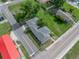 Aerial view of a residential property showing the layout of the house and its surrounding landscaping at 602 E Laura St, Plant City, FL 33563