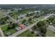 Aerial view showcasing location in residential neighborhood close to lake and park at 602 E Laura St, Plant City, FL 33563