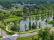 Aerial image capturing the serene lake and park area, perfect for nature lovers at 602 E Laura St, Plant City, FL 33563