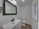 Renovated bathroom with modern vanity, lighting, and fixtures at 602 E Laura St, Plant City, FL 33563