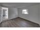 Bedroom featuring updated flooring, an open door, and a bright window with natural light at 602 E Laura St, Plant City, FL 33563