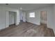 A bright renovated bedroom has gray laminate floors and ample closet space at 602 E Laura St, Plant City, FL 33563