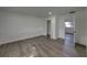 A bright bedroom features gray laminate floors and white walls at 602 E Laura St, Plant City, FL 33563