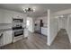 Well-equipped kitchen with stainless steel appliances, white cabinets, and ample counter space for culinary enthusiasts at 602 E Laura St, Plant City, FL 33563