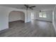 Open living area showcasing modern flooring, white walls, and an archway, perfect for entertaining and relaxing at 602 E Laura St, Plant City, FL 33563