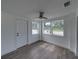 Bright room with modern flooring, white walls, and natural light streaming in from the windows at 602 E Laura St, Plant City, FL 33563