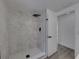 Updated shower with stylish tile, black fixtures, and glass door at 602 E Laura St, Plant City, FL 33563