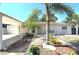 Inviting single-story home featuring a covered entrance, attached garage, and lush landscaping at 7943 Woodvine Cir, Tampa, FL 33615