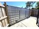 Sliding metal gate secures the backyard, offering privacy and functionality at 7943 Woodvine Cir, Tampa, FL 33615
