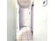 Hallway with tiled floor and multiple doors at 7943 Woodvine Cir, Tampa, FL 33615