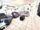 Cozy living room with tile floors, comfortable seating, and bright, airy atmosphere at 7943 Woodvine Cir, Tampa, FL 33615