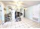 An open room with tiled flooring and arched mirrored walls at 7943 Woodvine Cir, Tampa, FL 33615