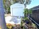 Small shed on property has new landscaping at 7943 Woodvine Cir, Tampa, FL 33615
