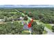 An aerial view shows the property and surrounding wooded acreage, offering privacy and seclusion at 106 Corbett Rd, Lithia, FL 33547