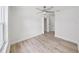 Bright bedroom with hardwood floors, ceiling fan, and a large window for natural light at 106 Corbett Rd, Lithia, FL 33547