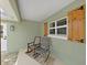 Cozy front porch featuring comfortable rocking chairs offering a relaxing space to enjoy the outdoors at 106 Corbett Rd, Lithia, FL 33547
