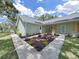 Front exterior showcases concrete walkway and lovely landscaping with various flowering plants at the front of the house at 106 Corbett Rd, Lithia, FL 33547