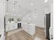 Open concept kitchen with bright white cabinets, stainless appliances, and a spacious center island at 106 Corbett Rd, Lithia, FL 33547