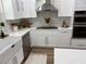 Modern kitchen featuring stainless steel appliances, white cabinetry, and an open layout at 106 Corbett Rd, Lithia, FL 33547