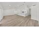 Spacious living area adjacent to kitchen featuring a large kitchen island with modern lighting at 106 Corbett Rd, Lithia, FL 33547