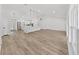 Spacious open-concept kitchen and living room with modern lighting at 106 Corbett Rd, Lithia, FL 33547