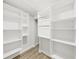 Walk-in closet featuring custom shelving and a hanging rod for maximum storage and organization at 106 Corbett Rd, Lithia, FL 33547