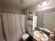 Bright bathroom with a shower and tub combination and ample counter space at 13443 Graham Yarden Dr, Riverview, FL 33579