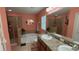 Bathroom with double sinks, a tub, and a separate shower at 13443 Graham Yarden Dr, Riverview, FL 33579