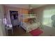 Bedroom featuring a bunk bed, carpet, and a closet at 13443 Graham Yarden Dr, Riverview, FL 33579