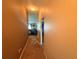 Hallway leading into living space with neutral walls at 13443 Graham Yarden Dr, Riverview, FL 33579