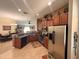 Open kitchen area with stainless steel appliances and a breakfast bar at 13443 Graham Yarden Dr, Riverview, FL 33579