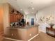 Spacious kitchen featuring wood cabinets and a breakfast bar countertop at 13443 Graham Yarden Dr, Riverview, FL 33579