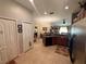 View of the kitchen and dining area with tile flooring at 13443 Graham Yarden Dr, Riverview, FL 33579