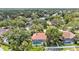 Spacious backyard featuring a screened-in pool with lush landscaping and privacy fencing at 2332 Timbergrove Dr, Valrico, FL 33596