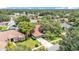 Beautiful aerial view of a landscaped home with mature trees in a residential neighborhood at 2332 Timbergrove Dr, Valrico, FL 33596