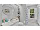 Clean bathroom featuring a shower stall and skylight above the sink at 2332 Timbergrove Dr, Valrico, FL 33596