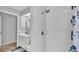 Bright bathroom featuring a shower stall and vanity with sink at 2332 Timbergrove Dr, Valrico, FL 33596