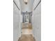 Hallway view into bathroom featuring a large soaking tub, separate shower, and a window for natural light at 2332 Timbergrove Dr, Valrico, FL 33596