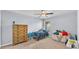 Comfortable bedroom with ceiling fan, neutral carpet and good natural light at 2332 Timbergrove Dr, Valrico, FL 33596